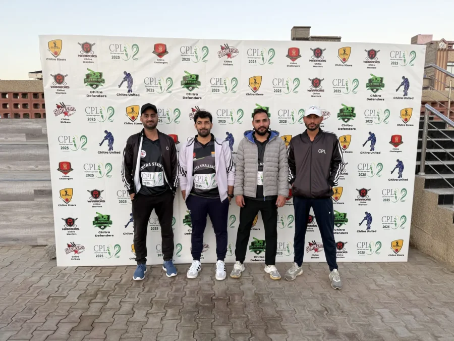 Four men standing in front of the CPL sponsor wall