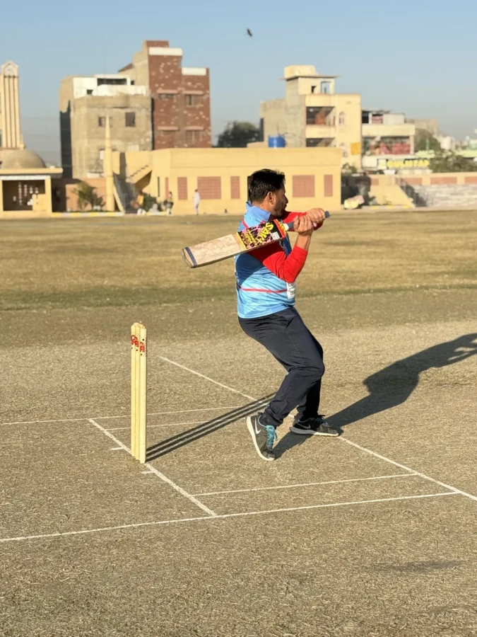 A batsman playing a shot at the crease