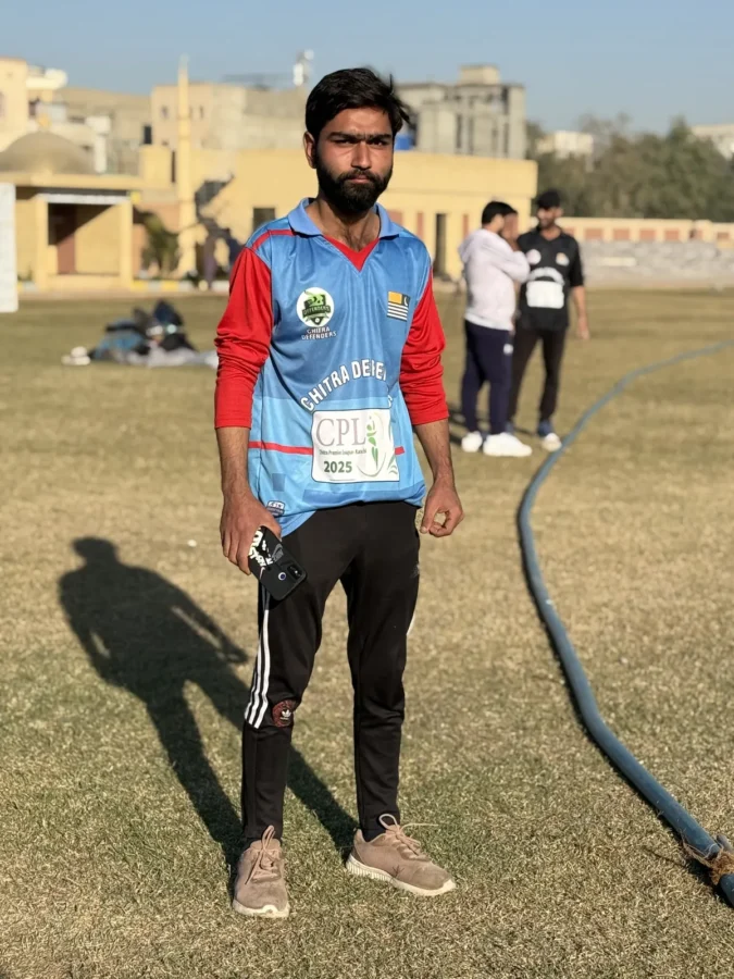 A player in a light blue kit on the ground